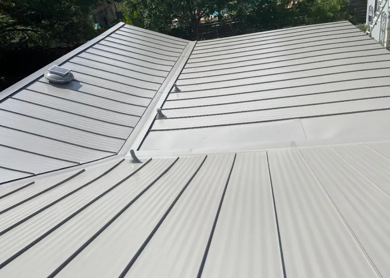 Solar attic fan installed on a metal roof for Roof Ventilation in June Park